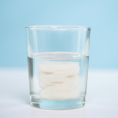 To prep a Skinsheet Cleansing Coin, moisten with water or micellar water and unroll into a cloth.